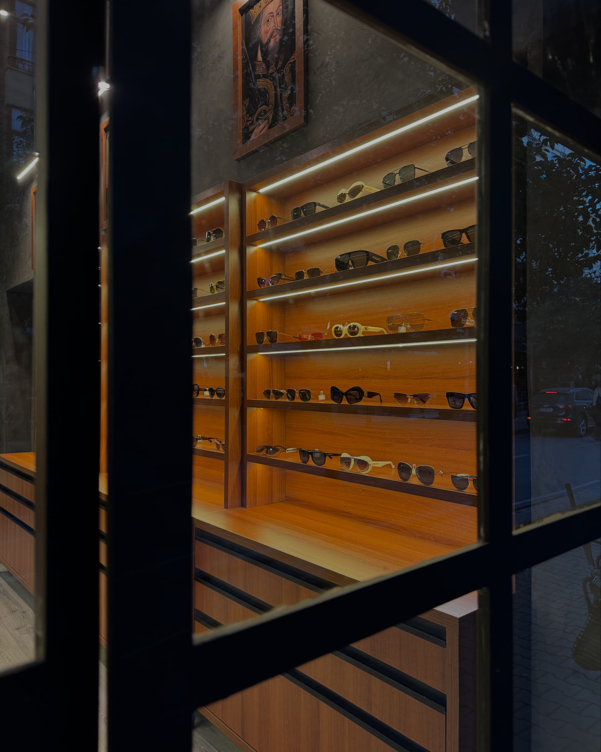 Gloved artisan preparing precision lenses for bespoke frames